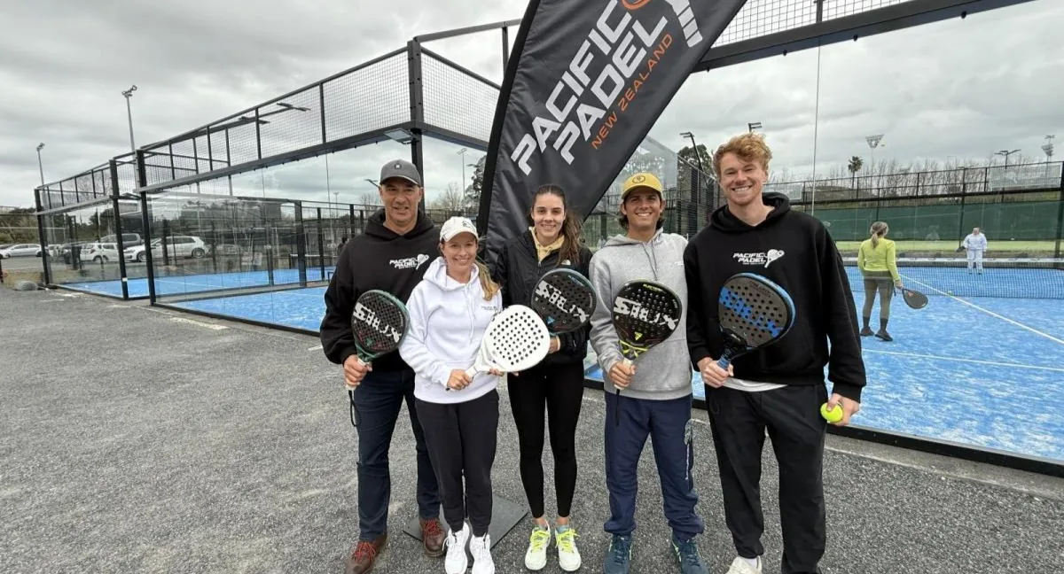 Players beside the outdoor padel courts at Pacific Padel Albany