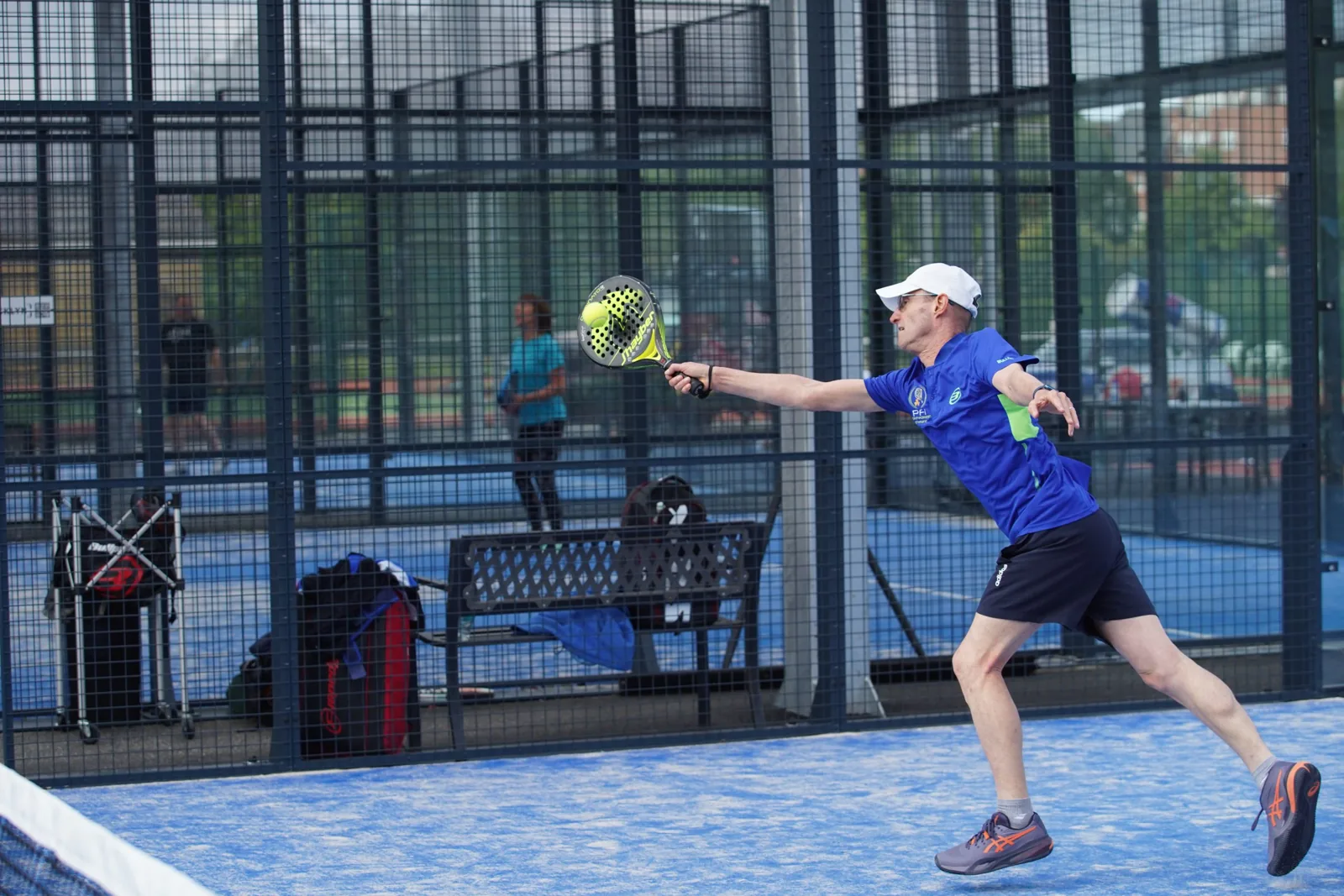 Padel player on court at Belfast Boat Club