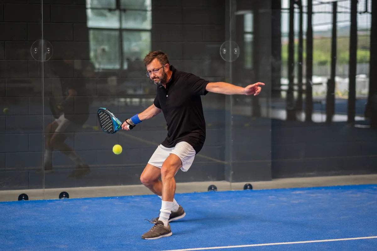 Player on an indoor court at Core Padel Tyseley