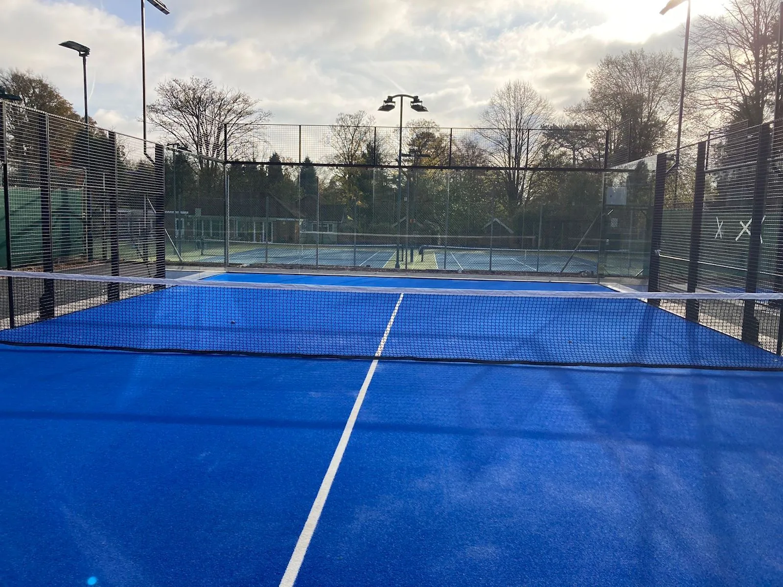 Padel court at Four Oaks with the tennis courts behind