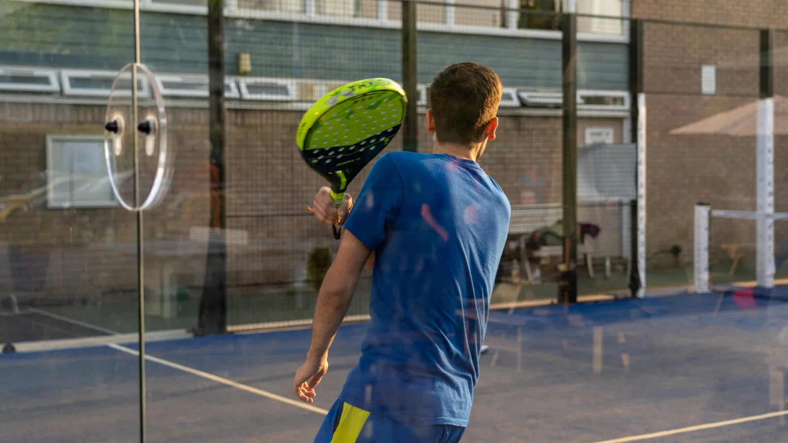 Padel player on court at Redland Green Club