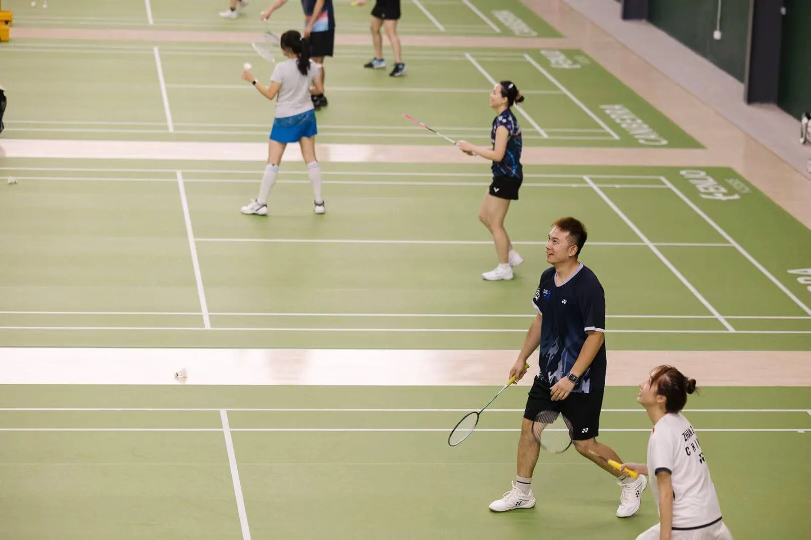 Players on court at Canberra Badminton Centre