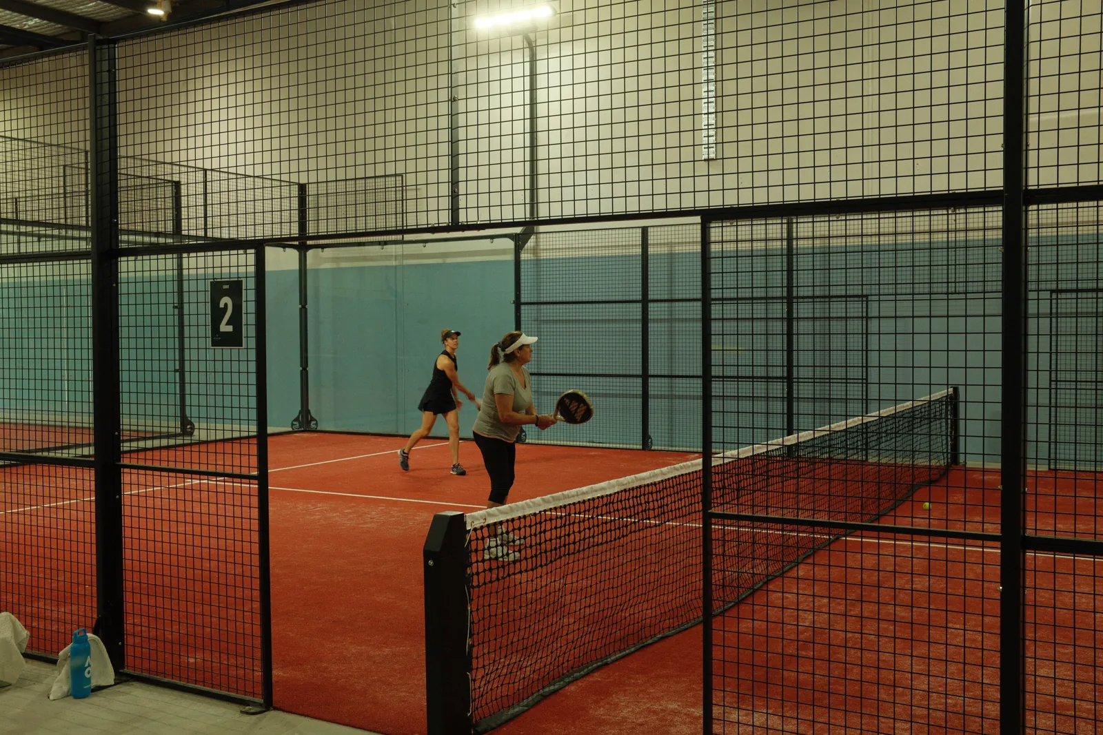 Players on indoor court 2 at La Palma Padel Club, Tuggerah
