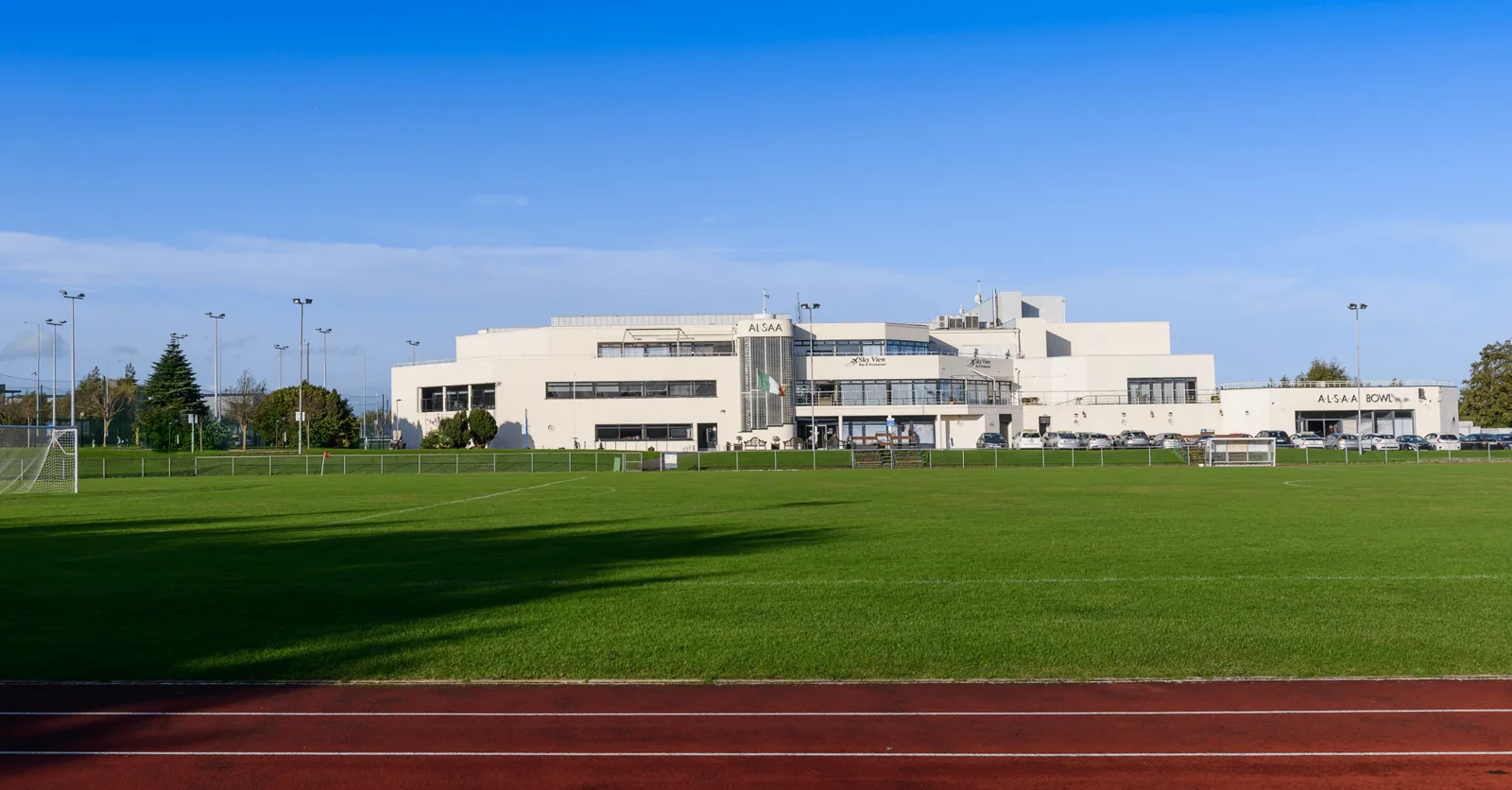 ALSAA sports complex building seen from its playing fields