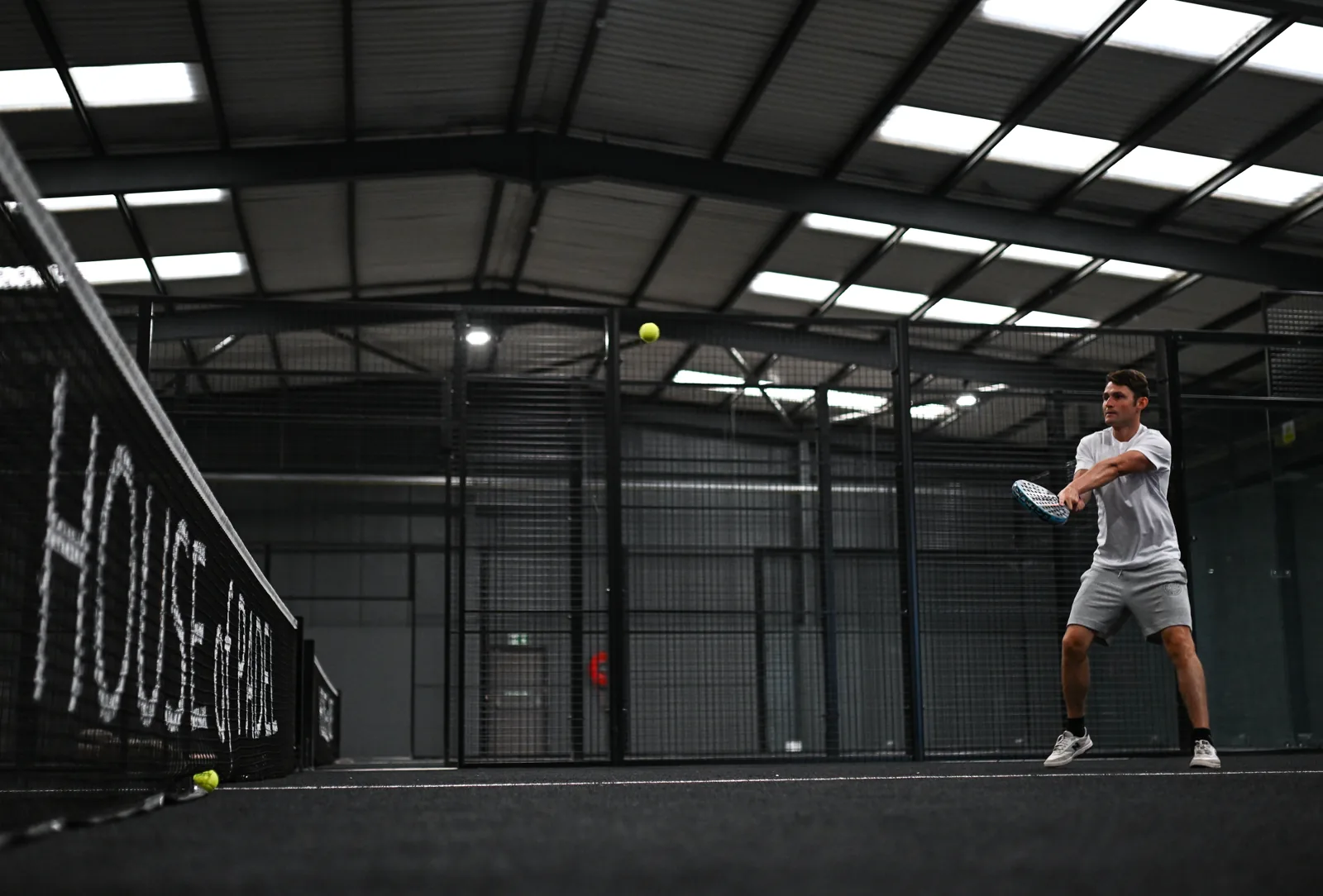 Player on a House of Padel court