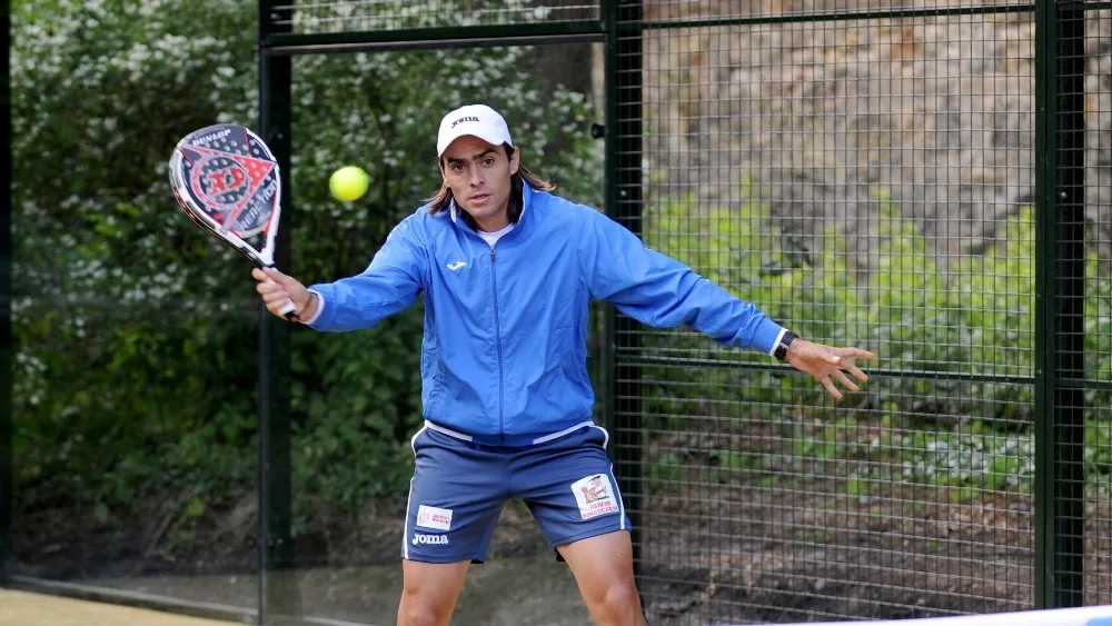 Padel player on court at Edinburgh Sports Club