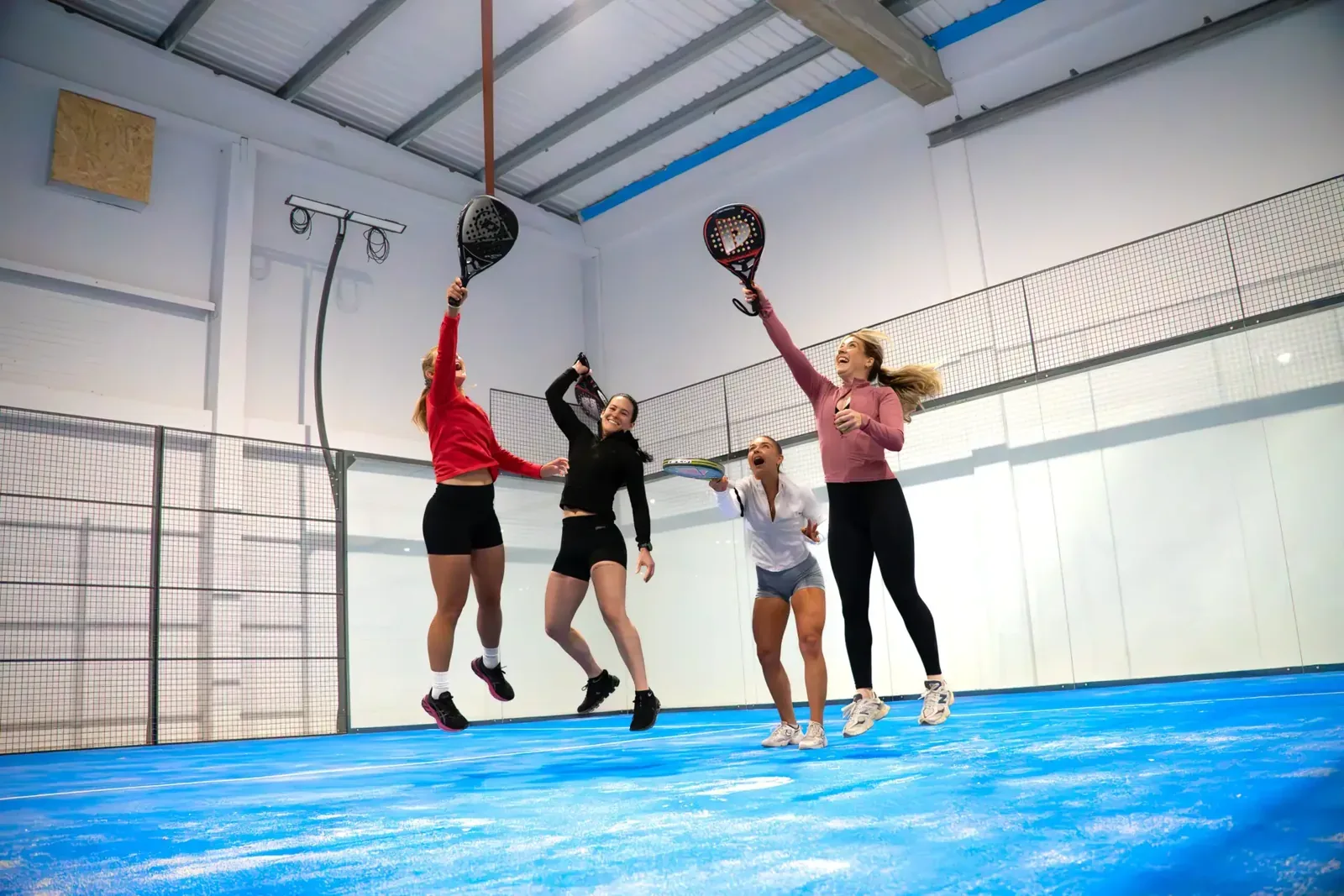 Players on an indoor padel court at Court De Padel Hull