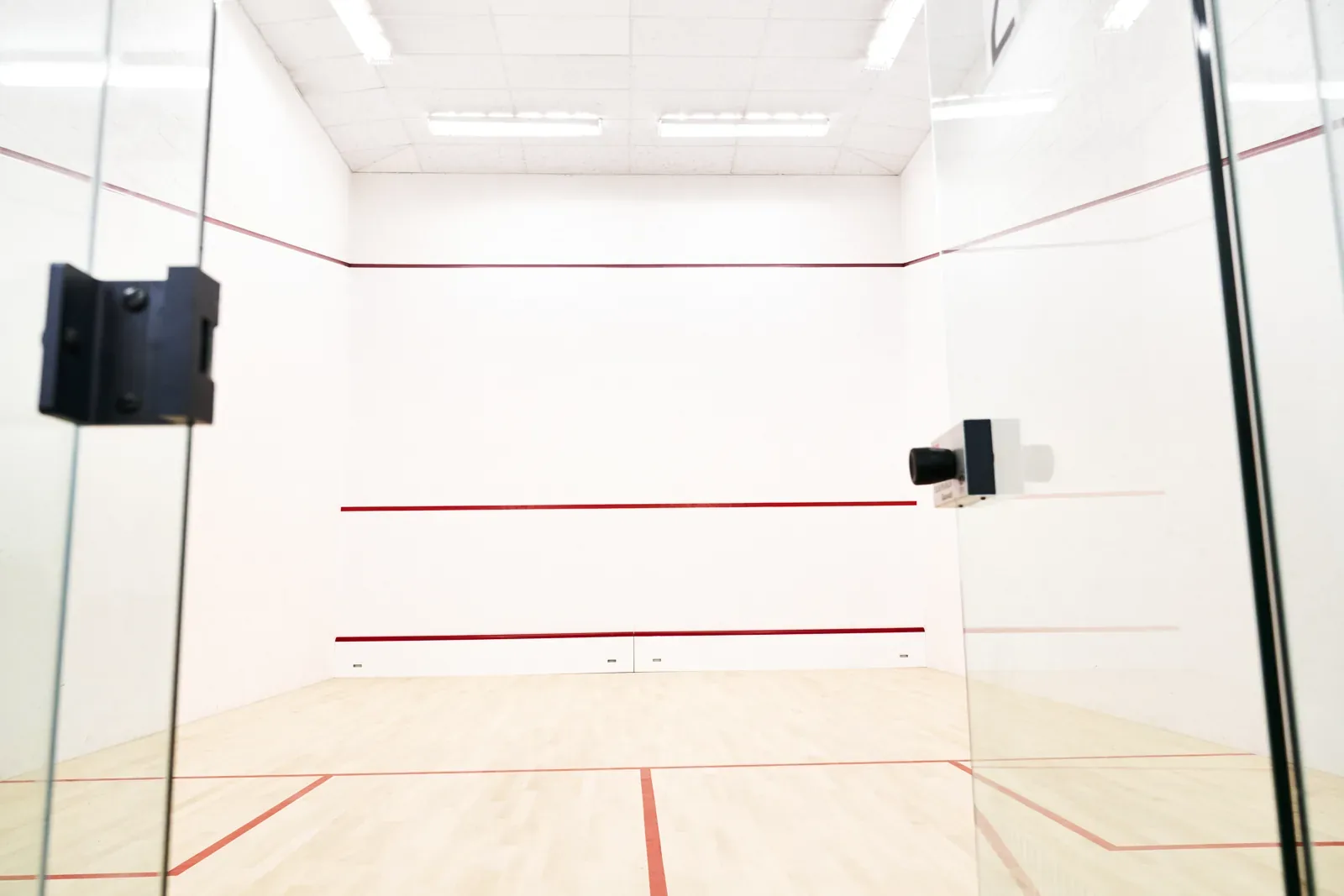 Glass-backed squash court at Beckett Sport, used for squash and racketball