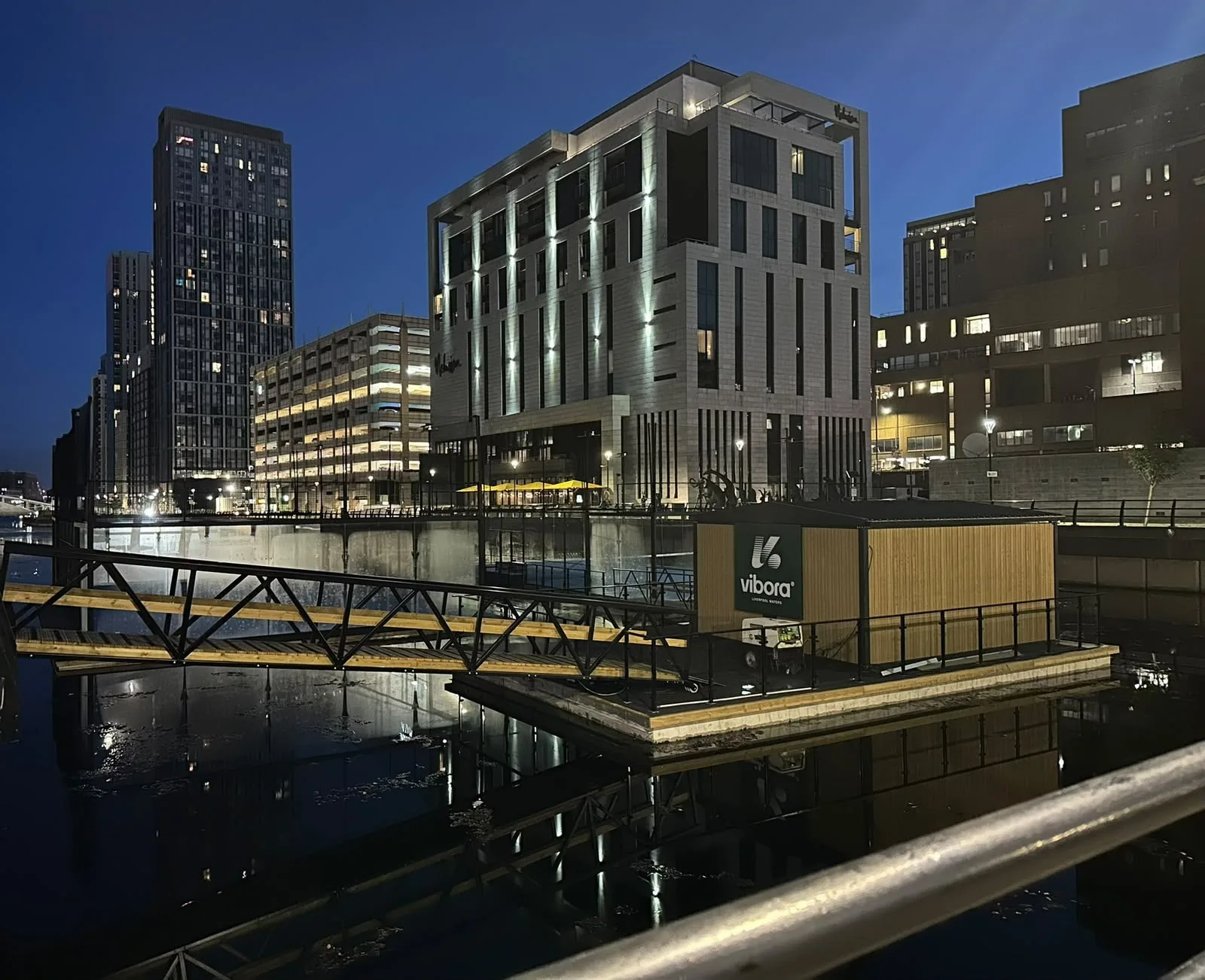 Vibora’s floating clubhouse on Princes Dock at night