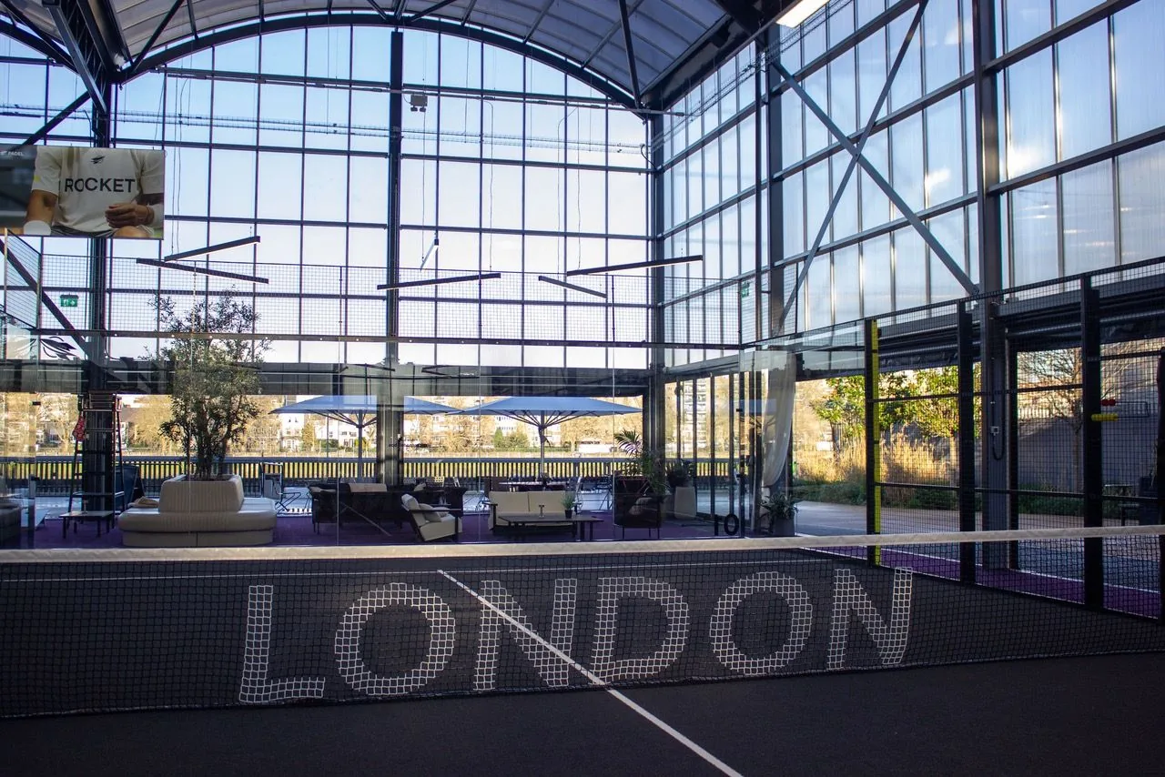 Indoor padel court inside the glass hall at Rocket Padel Battersea