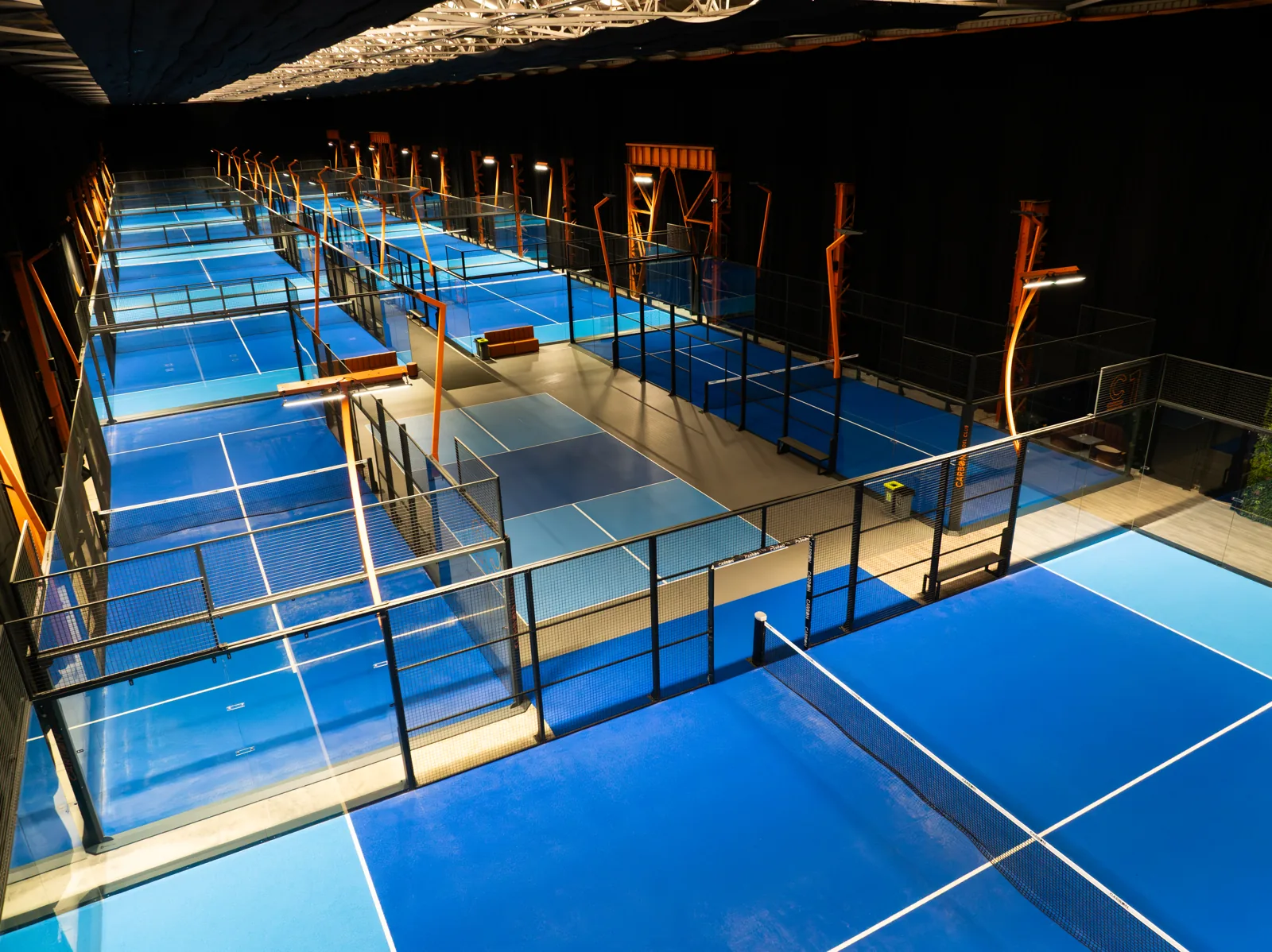 Indoor padel courts at Carbon Padel Club, seen from above