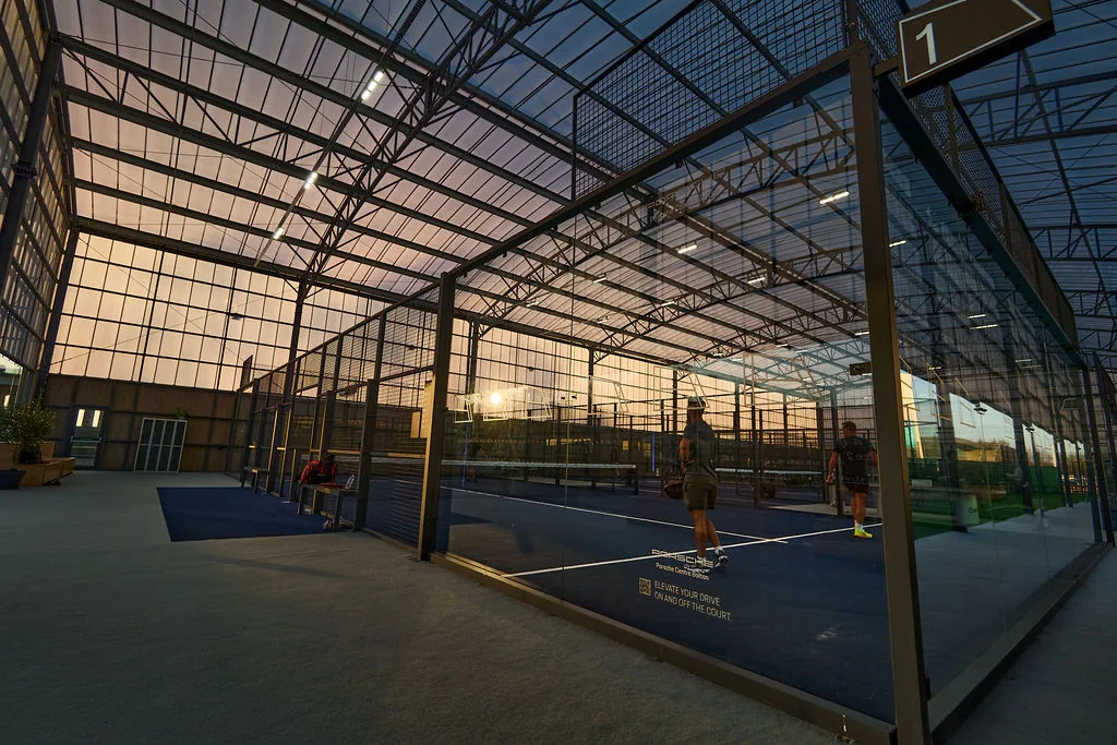 Court 1 at The Padel Club TraffordCity in the evening