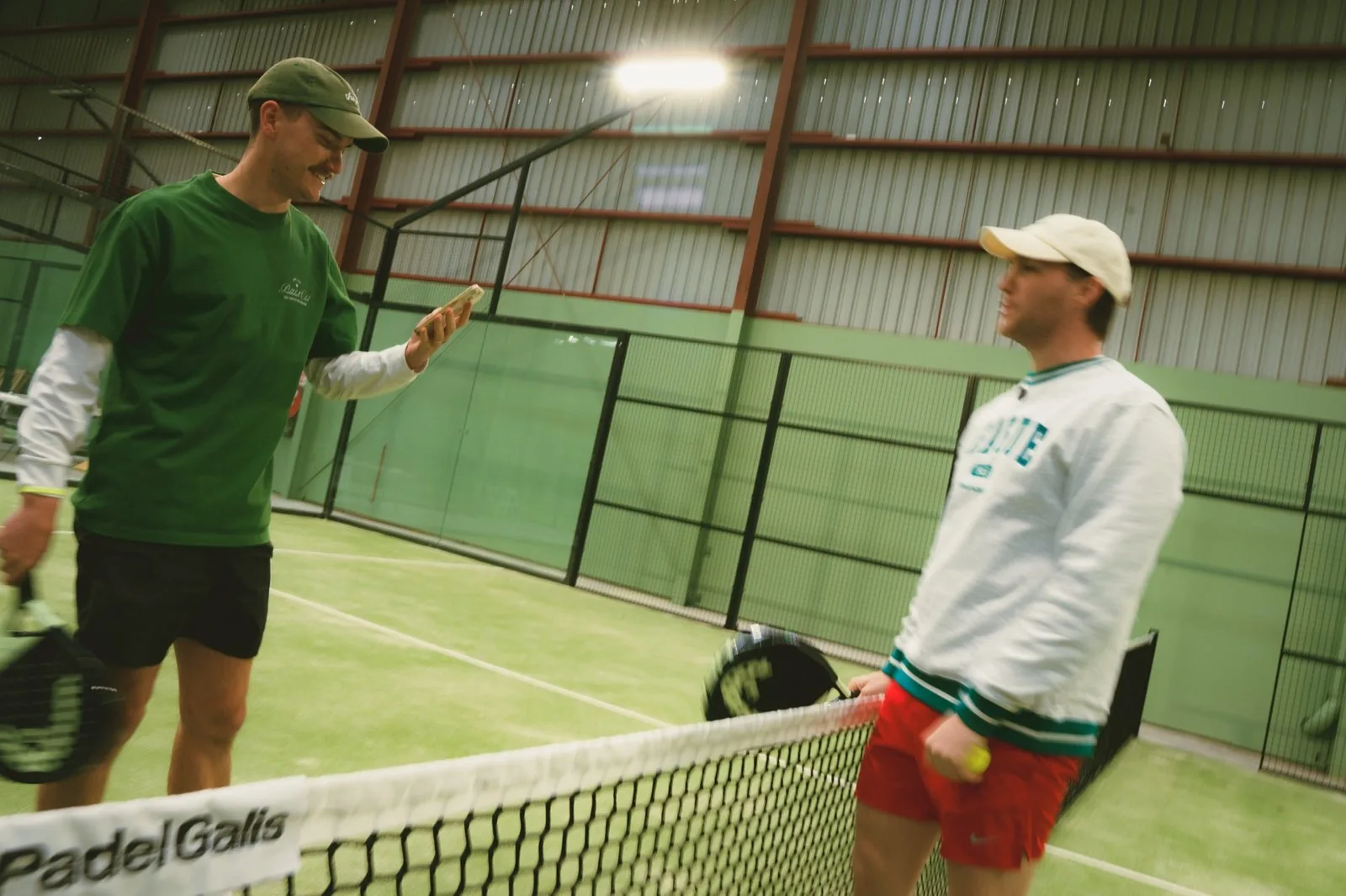 Players at the net on a padel court at The Jar Maidstone