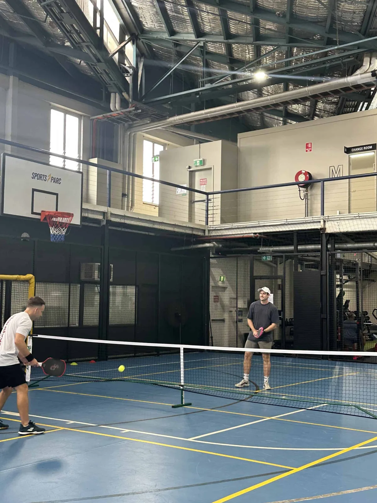 Pickleball net set up on an indoor court at Sports Parc