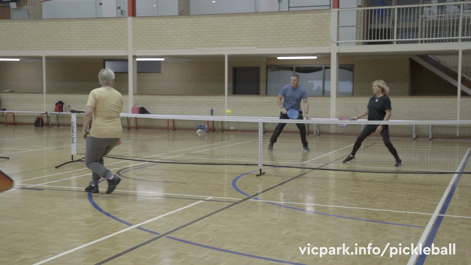Pickleball in the sports hall at Leisurelife Centre (still from the centre's pickleball video)