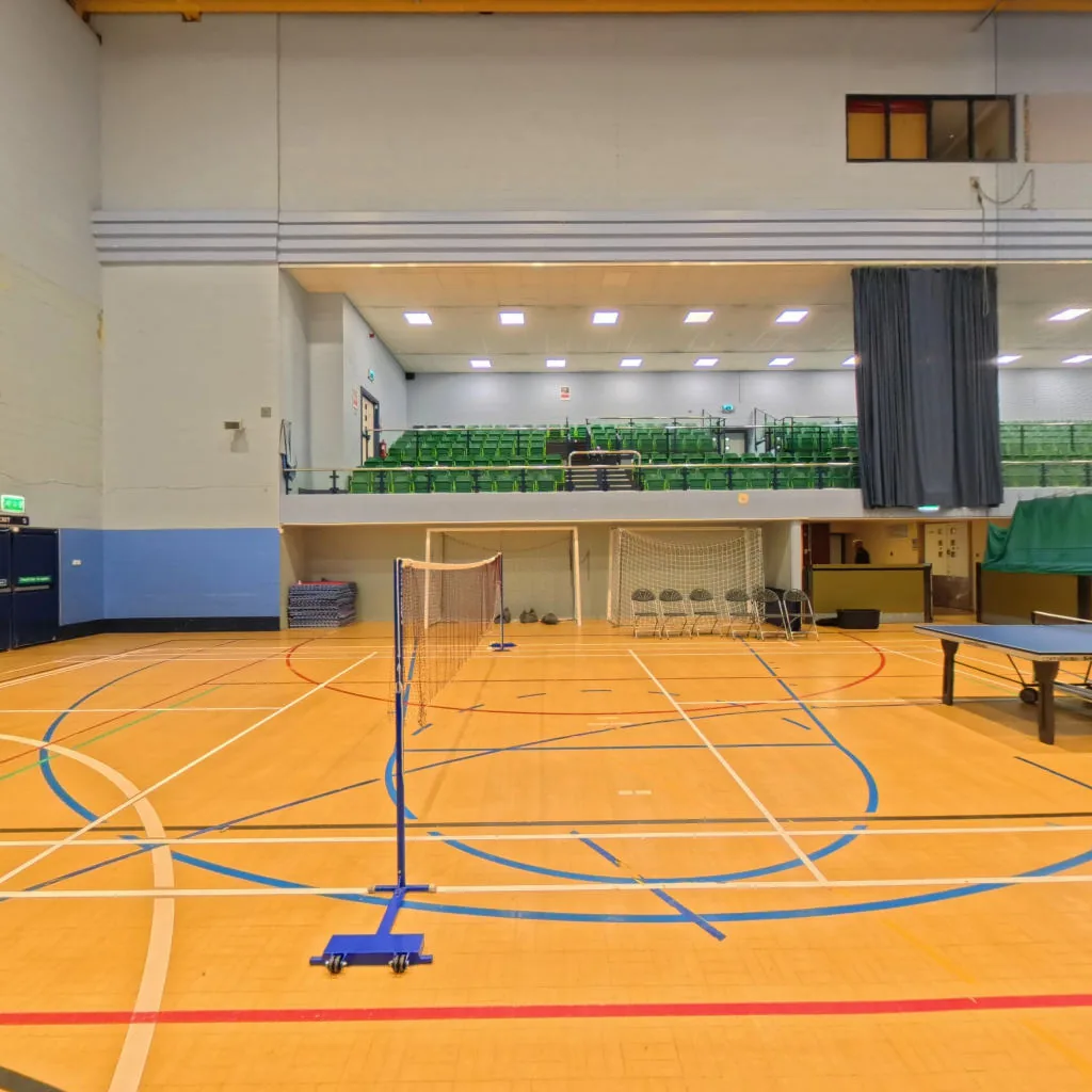 Badminton net and table tennis table in the sports hall at Hillsborough Leisure Centre