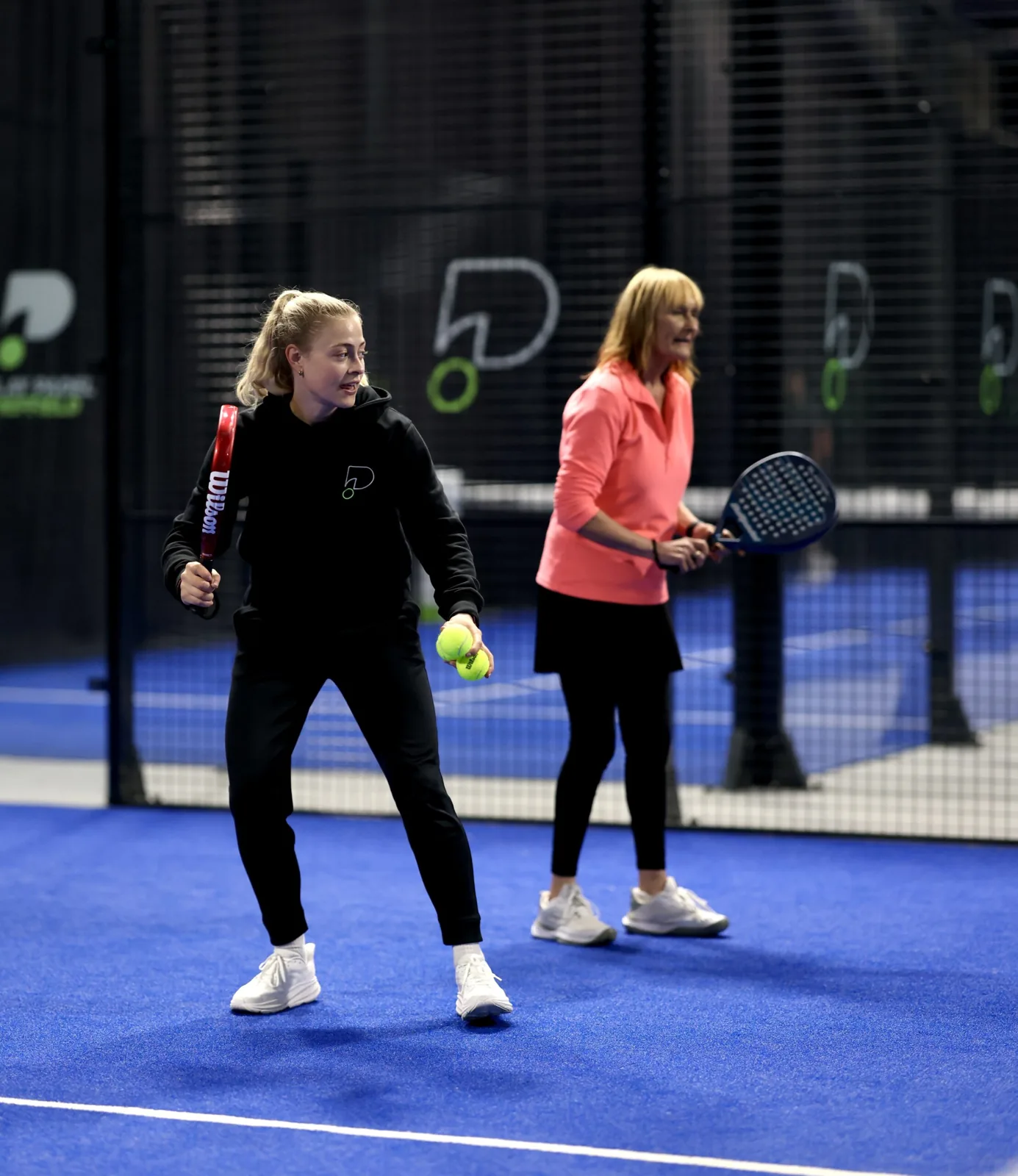 Players on an indoor padel court at Play Padel Sheffield