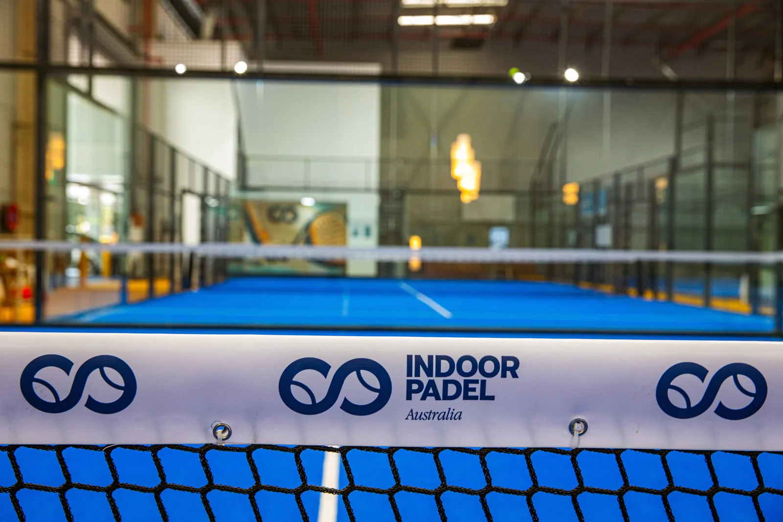 Branded net on an indoor court at Indoor Padel Australia