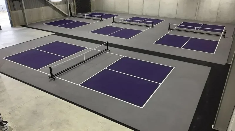 Four fenced indoor pickleball courts at Pickleball Park NZ