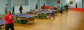 Players at the tables inside the Newtown table tennis stadium