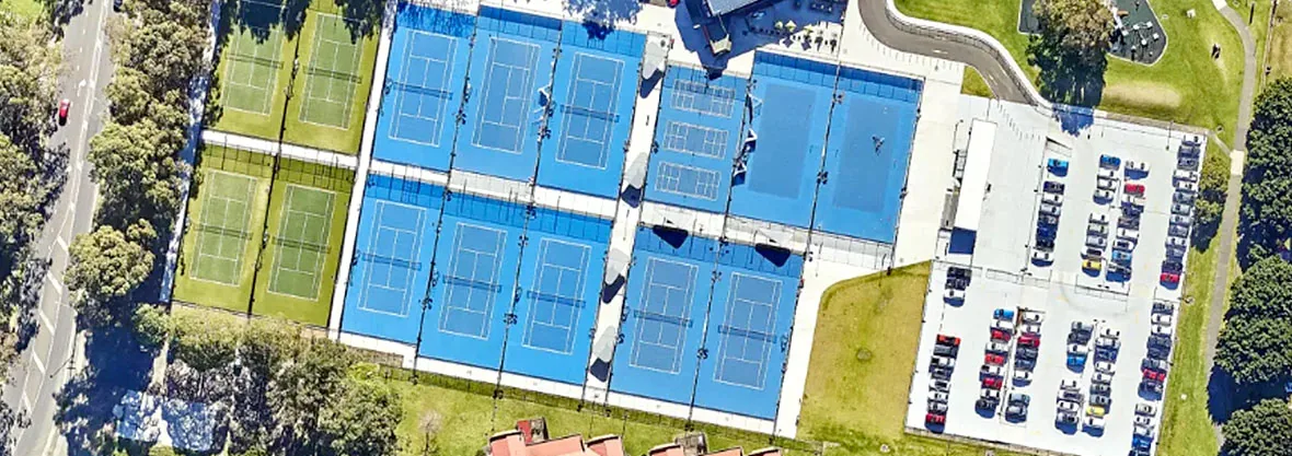Overhead view of the hard courts and synthetic grass courts at Beaton Park Tennis Centre