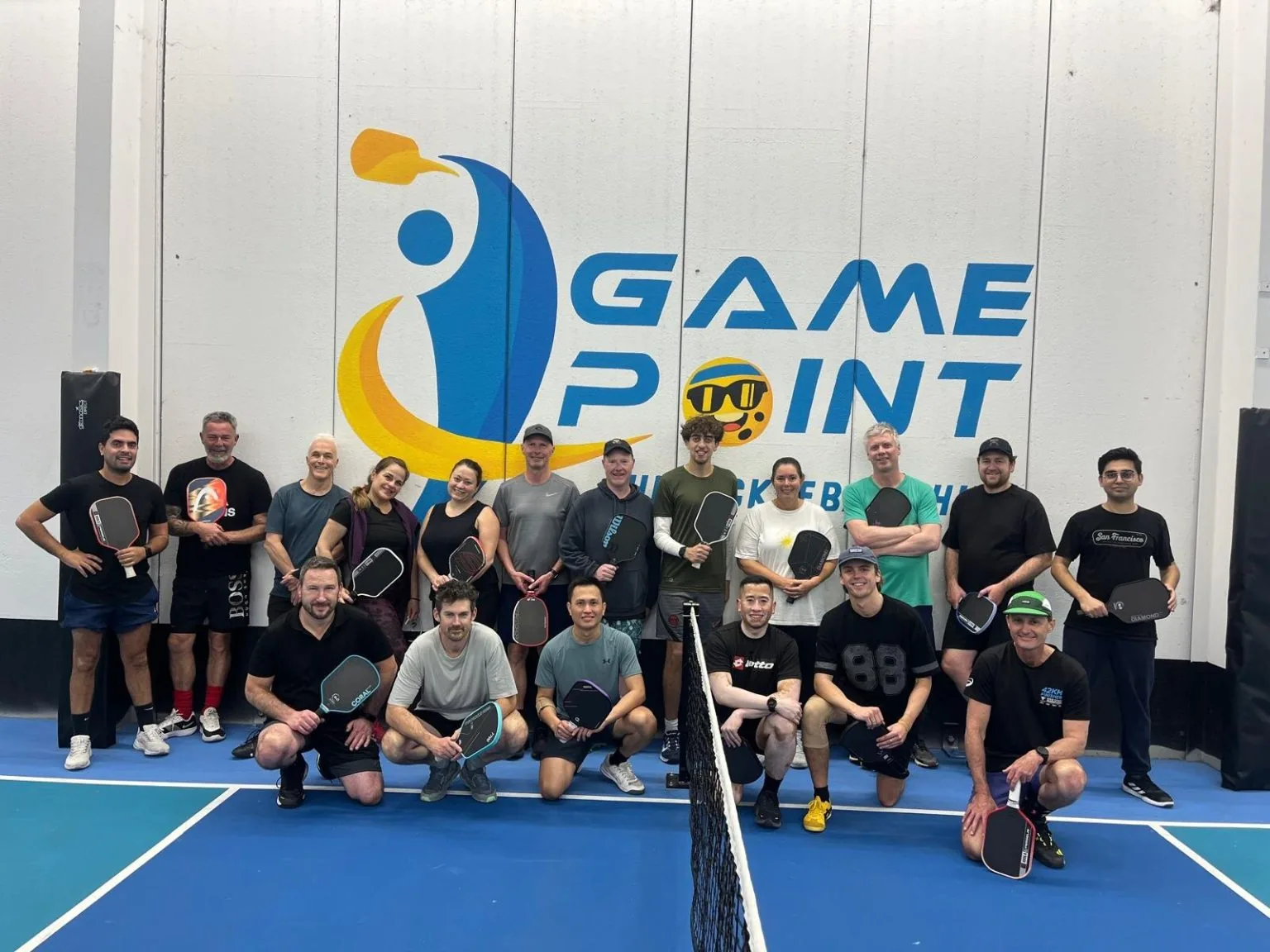 Social session group on court at Game Point Coniston